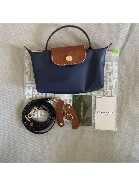 Longchamp Handbags - Longchamp navy nylon mini tote with brown leather flap and handle